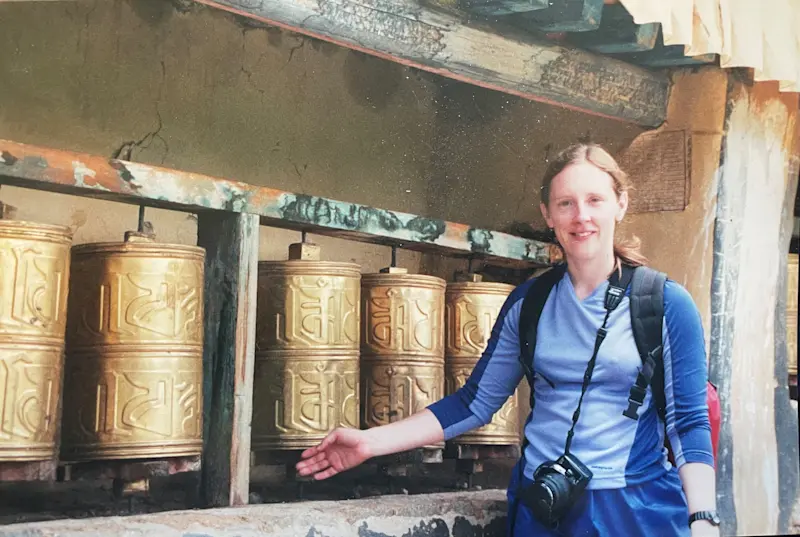 Connecting with sacred prayer wheels in Tibet, China.