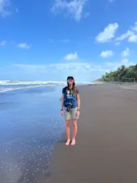 Smiling for a photo on Tortuguero beach in Costa Rica. 