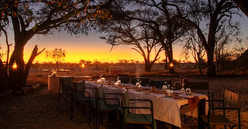 Outdoor dining area at Nat Hab's Gomoti Camp