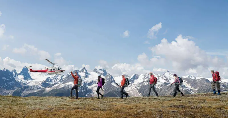 Guests heli-exploring in the Canadian Rockies, Alberta.