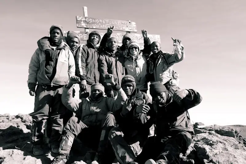 Top of Mt. Kilimanjaro with my team when living in Tanzania.