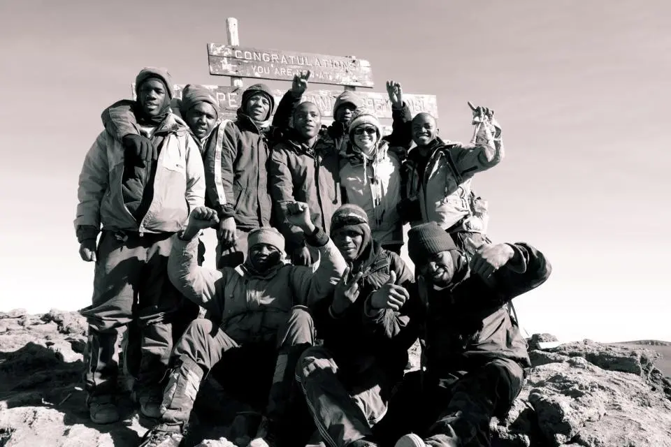 Top of Mt. Kilimanjaro with my team when living in Tanzania.