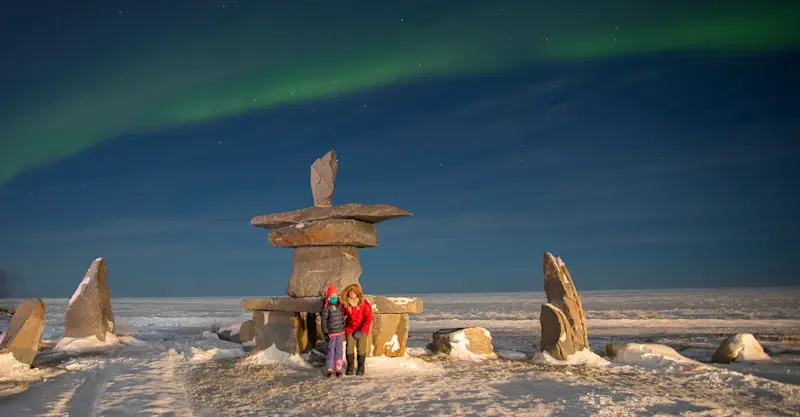 Nat Hab guests in front of Inukshuk, Churchill, Manitoba.