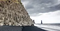 Black sand beach and basalt columns, Reynisfjara, Iceland.	