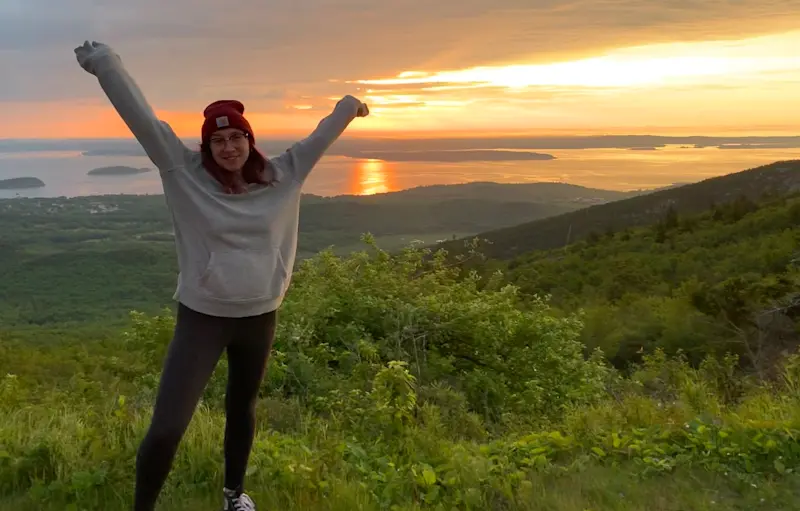 Watching the sunrise on Cadillac Mountain in Acadia National Park, Maine.