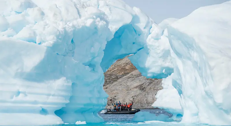 Nat Hab guests on Zodiac ride, Sermilik Fjord, Greenland.