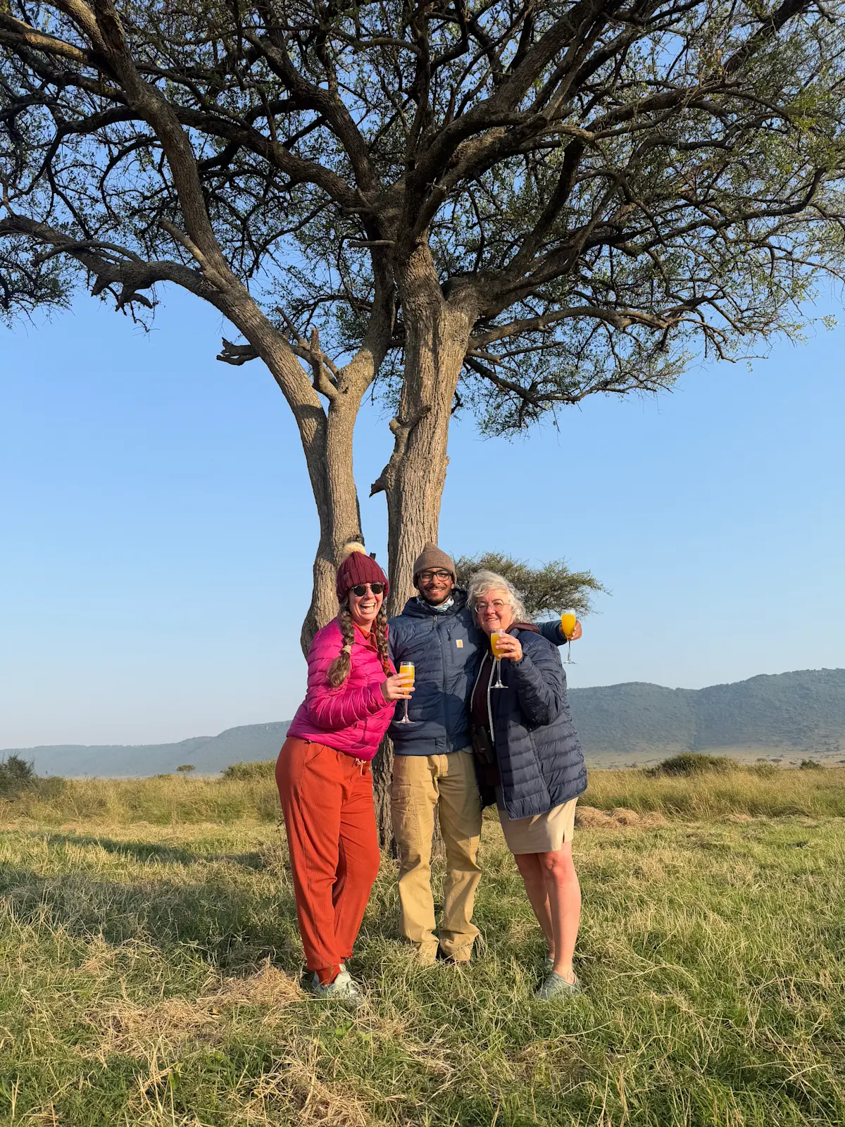 Celebrating an unforgettable morning with a champagne breakfast after a sunrise balloon safari in Tanzania, Africa.