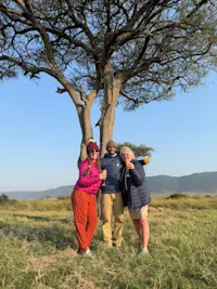 Celebrating an unforgettable morning with a champagne breakfast after a sunrise balloon safari in Tanzania, Africa.