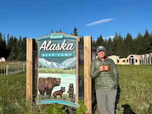 Enjoying a peaceful cup of coffee on the shores of Chinitna Bay, Lake Clark National Park in Alaska.