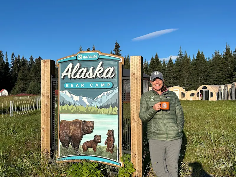 Enjoying a peaceful cup of coffee on the shores of Chinitna Bay, Lake Clark National Park in Alaska.