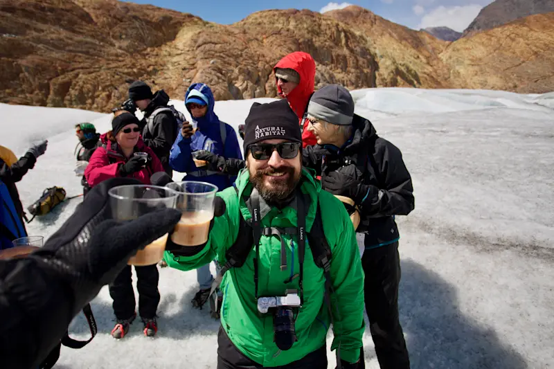 Cheers with Zapa, another extraordinary Nat Hab guide, as we climb across a glacier in Patagonia.