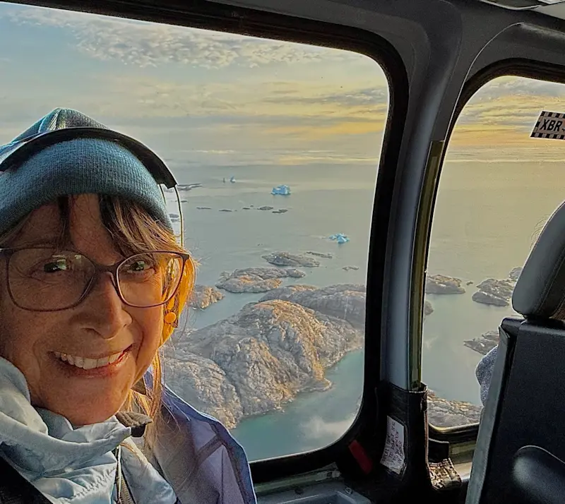 First heli ride—icebergs below, and a glimpse from the sky! From Kulusuk to Tasiilaq, Greenland.