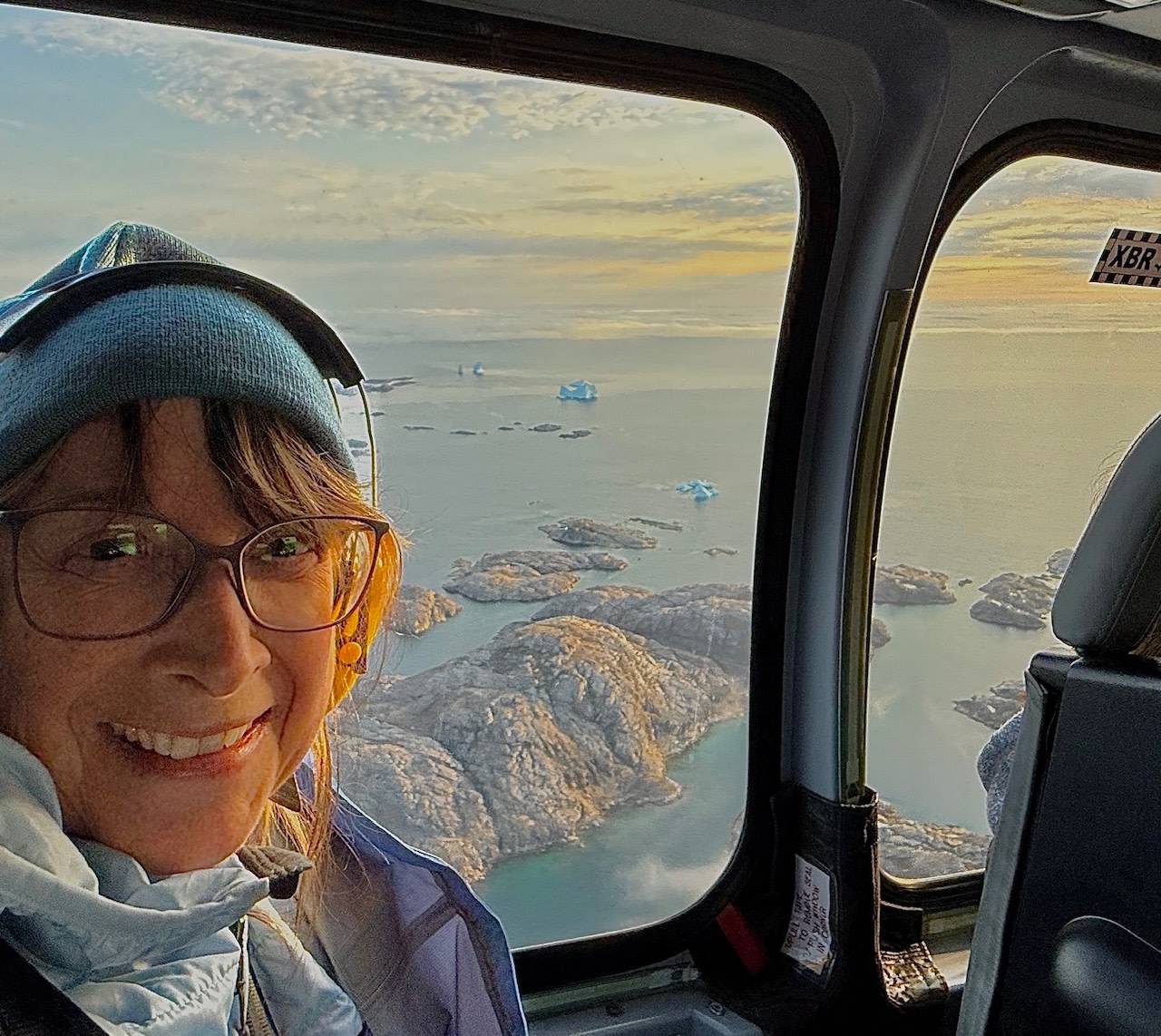 First heli ride—icebergs below, and a glimpse from the sky! From Kulusuk to Tasiilaq, Greenland.