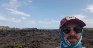 Standing near Lava field in the Galapagos Islands.