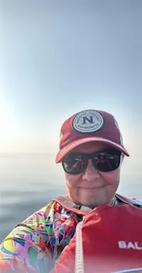 Kayaking alongside beluga whales in Hudson Bay, Churchill, Canada. 