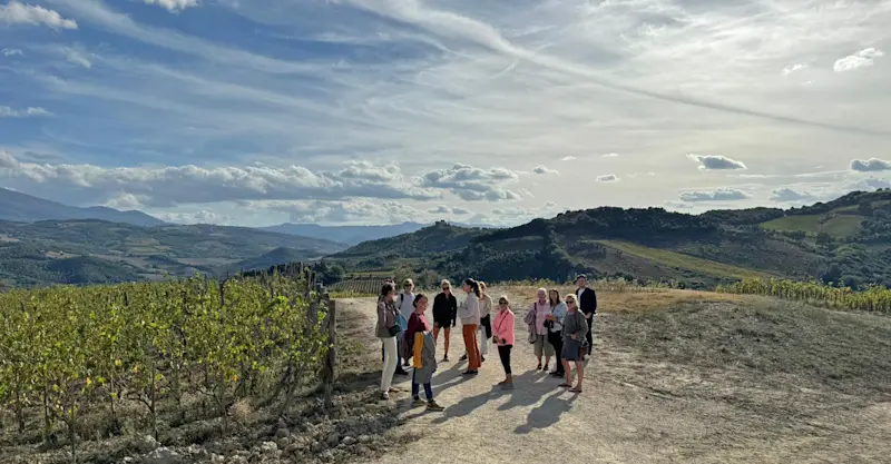 Guests on a private vineyard tour, Asciano, Italy.