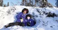 Nat Hab guests in abandoned polar bear den, Churchill, Manitoba.