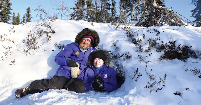 Nat Hab guests in abandoned polar bear den, Churchill, Manitoba.