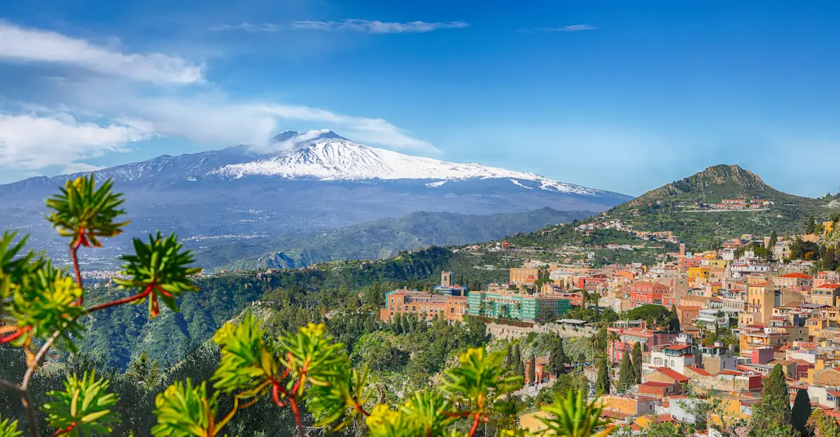 Hilltop town of Taormina overlooking Mount Etna, Sicily, Italy.