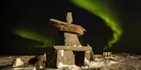 Northern lights above Inukshuk, Churchill, Manitoba.