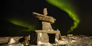 Northern lights above Inukshuk, Churchill, Manitoba.