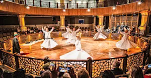 Sufi dervishes performing the traditional whirling Sema ceremony, Konya, Turkey.