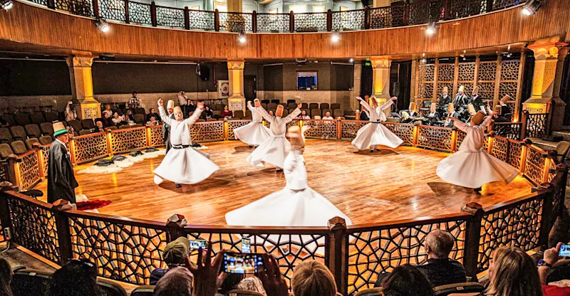 Sufi dervishes performing the traditional whirling Sema ceremony, Konya, Turkey.