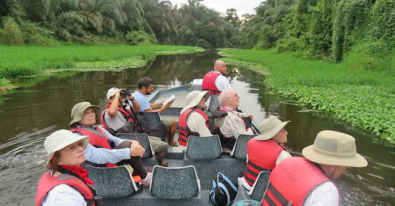 Nat Hab guests on river boat, Tortuguero National Park, Costa Rica.