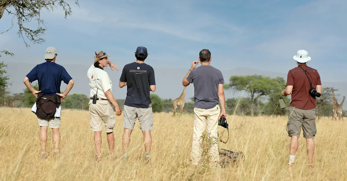 Nat Hab guests on guided bush walk, Private Mara Conservancy, Kenya.