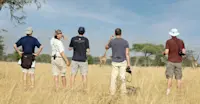 Nat Hab guests on guided bush walk, Private Mara Conservancy, Kenya.