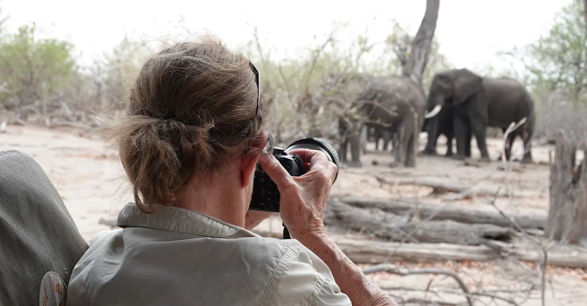 Nat Hab guest and elephants, Okavango Delta, Botswana.