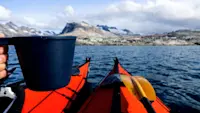 Sipping hot chocolate during a kayaking break in Greenland.