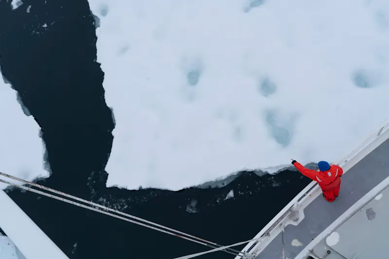 Pointing at an ice sheet as we pass on by in the Australis in Antarctica. 