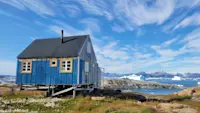 Experiencing a beautiful day near a house in Tinit, East Greenland.