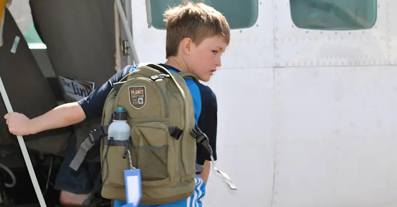Nat Hab guest boards a bush plane, Botswana.