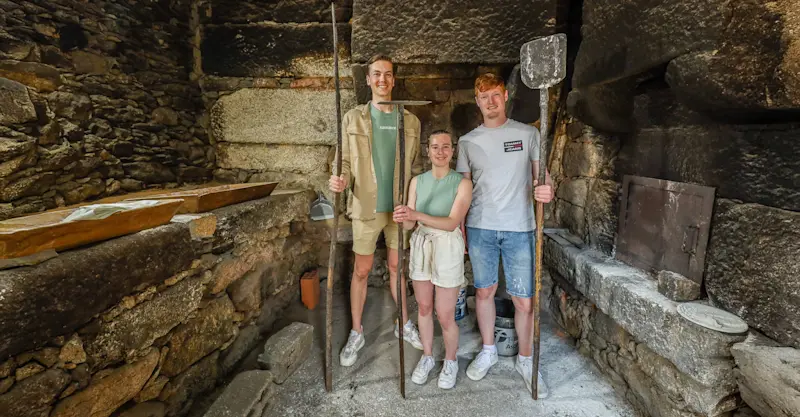 Guest making traditional bread, Videmonte, Portugal.