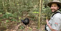 Southern cassowary and Nat Hab Expedition Leader, Daintree National Park, Australia.