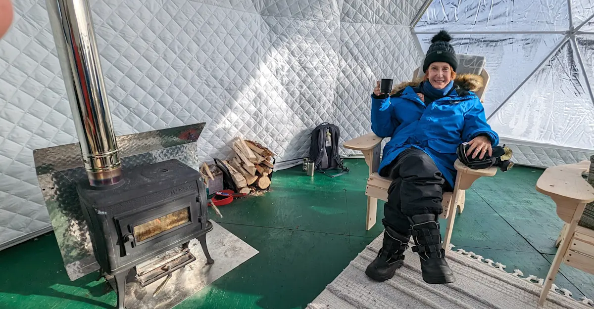 Nat Hab guest in the Aurora Sphere, Churchill, Manitoba.
