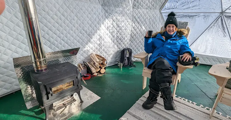 Nat Hab guest in the Aurora Sphere, Churchill, Manitoba.