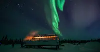 Nat Hab's Aurora Pod® underneath northern lights