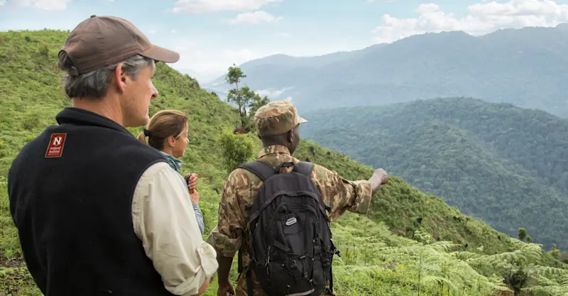 Nat Hab guests and local porter, Bwindi Impenetrable Forest National Park, Uganda.