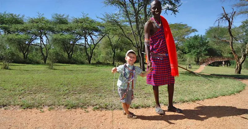 Maasai man and Nat Hab guest, Maasai Mara Private Conservancy, Kenya.