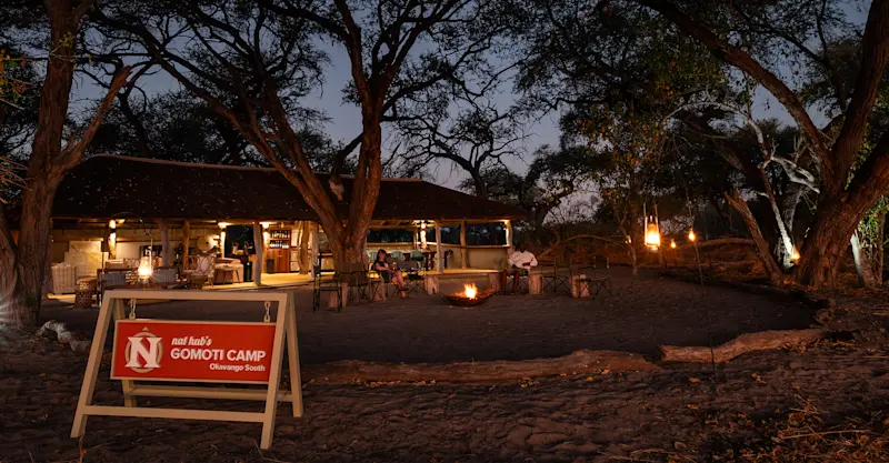 Travelers lounging outside in the evening