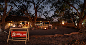 Travelers lounging outside in the evening