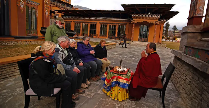 Nat Hab guests with local monk, Thimphu, Bhutan.