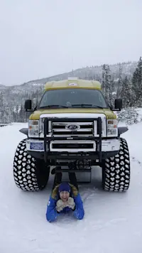 Peaceful, pristine, and powered by monster-truck snow coaches through Yellowstone, in Wyoming.
