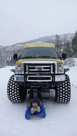 Peaceful, pristine, and powered by monster-truck snow coaches through Yellowstone, in Wyoming.