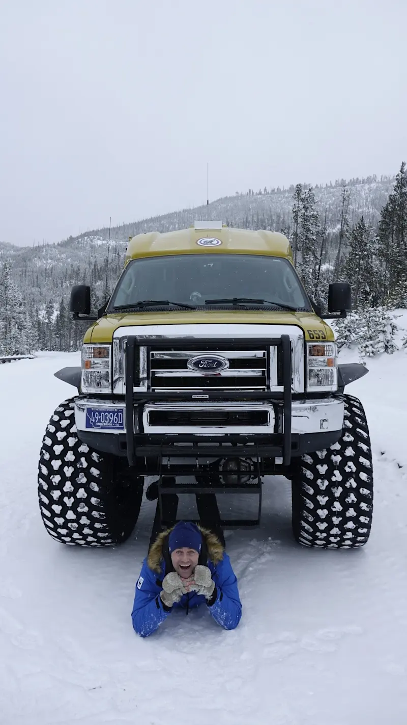 Peaceful, pristine, and powered by monster-truck snow coaches through Yellowstone, in Wyoming.