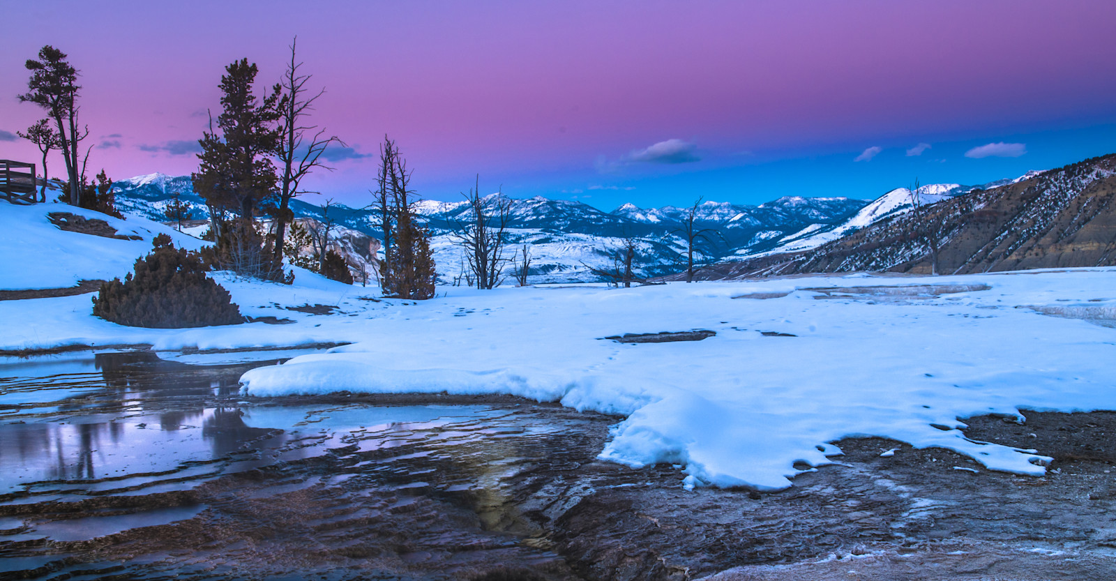 Snowy landscape at sunset, Yellowstone National Park, Wyoming.