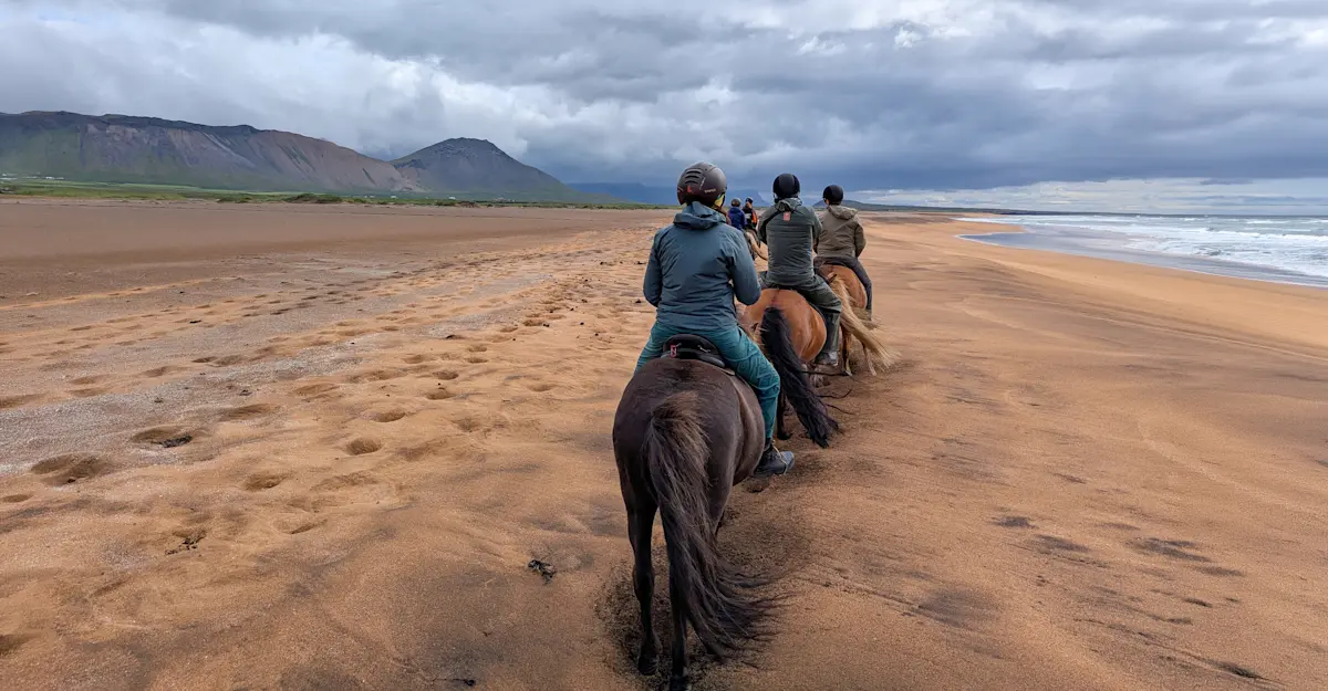 Horseback ride on Hraunlandarif Beach, Snaefellsnes, Iceland.